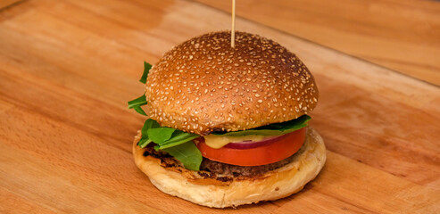 Beef burger on wooden plate
