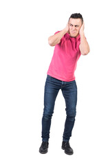 Angry man covering ears from noise. White background