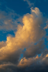 Fototapeta na wymiar Wonderful vanilla clouds on blue sky at sunset time