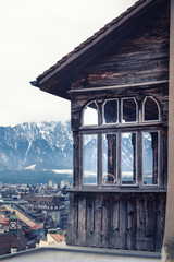 Thun Switzerland, detail of a characteristic wooden balcony of the city of Thun with the Bernese Alps and the Thunersee. Thun is a city with characteristic houses typical of the canton of Bern in Swit
