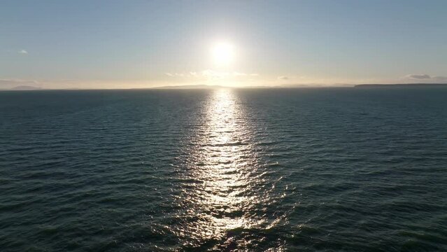 sun down on the sea with horizon line view by the drone camera