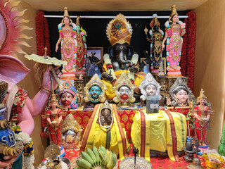 Black Ganesh and the Goddess Kali in various postures. All of these are Hindu gods. People worship...