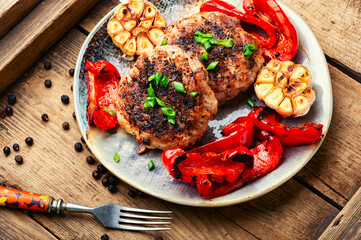 Fried juicy beefsteak in bacon