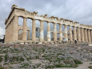 Fototapeta premium Roman empire heritage in Athens seen as curious tourists walk the old town and popular sights