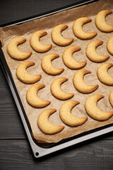 Baking tray with traditional German or Austrian Vanillekipferl vanilla kipferl cookies