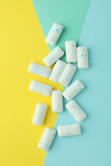 Chewing or bubble gum on multicolored background