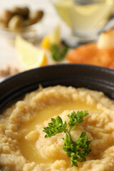 Concept of tasty food with hummus, close up