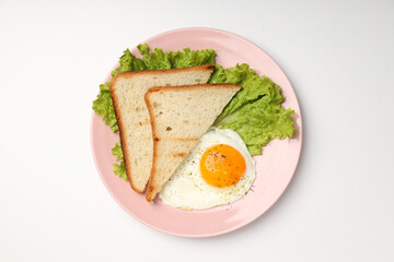 Plate with tasty breakfast on white background