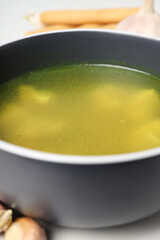 Concept of tasty food with chicken soup or broth, close up
