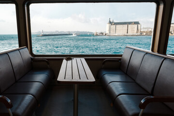 Seats and a table inside a ferry in Istanbul. Istanbul river transport. deck chair on the cruise ship