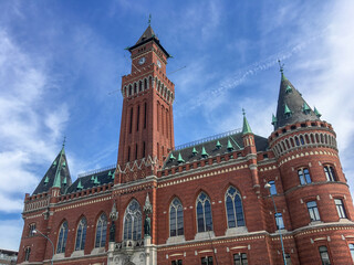 Fototapeta na wymiar The red brick city hall of Helsingborg Sweden on a bright summer day