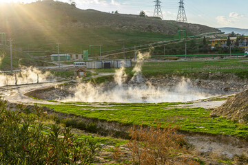 cenic views of thermal springs and mud bath in Sarayköy which contains bicarbonates and sulfates and power plant producing electricity from the geothermal steam, Denizli, Turkey