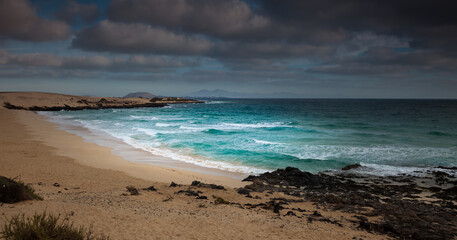coast of the azure sea and thunderclouds