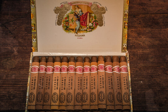 Box of Romeo and Julieta Cuban cigars on wooden rustic background.