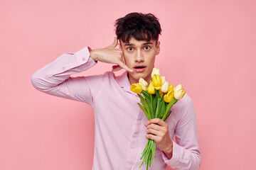 handsome guy bouquet of flowers date romance posing isolated background unaltered