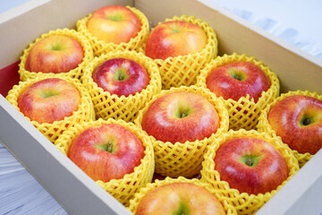 Fresh Red apple in packaging ready to sell, US. Red Envy apple in the box.