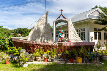 Statue of Sainte Anne of Praslin standing on a boat shaped chapel outside the St Anne’s Catholic...