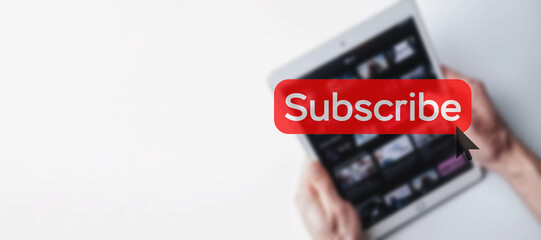Subscribe button. Online video subscription red button. Internet service on laptop digital tablet blured banner background. Visual contents concept. Social networking service.