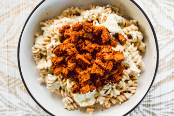 vvegan carbonara-inspired pasta with creamy cashew sauce and spicy tempeh bacon, healthy plant-based food