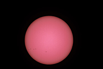 Sunspots are temporary phenomena on the Sun's photosphere that appear as spots darker than the surrounding areas. They are regions of reduced surface temperature caused by concentrations of magnetic f