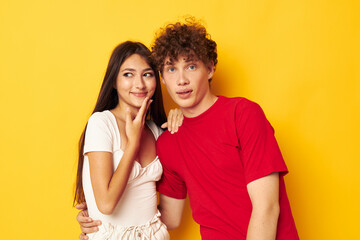 Naklejka premium young boy and girl hug together antics Lifestyle unaltered
