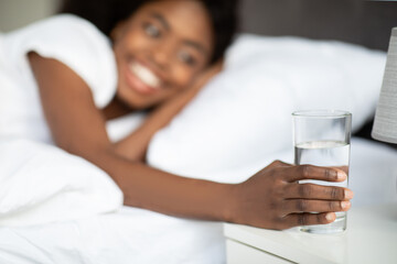 Selective focus on glass of water at bedside