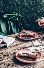 Table scene of a piece of cherry pie.