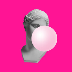 Creative moern design. Antique statue bust with pink bubble gum isolated over neon pink background