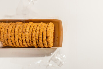 Cookies, Biscuits Pack on White Background.Pack of biscuits, wrapped with transparent plastic.Studio shot,top view.copy space.