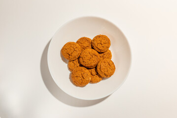 Cookies,Biscuits on white plate top view on white background.