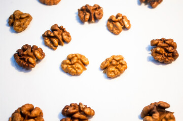 Stack of walnuts on white background