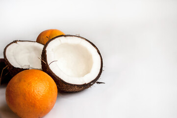 summer background from coconut, orange on pink background