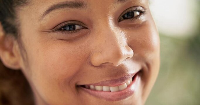 Young, confident and smiling. Cheerful young woman smiling and looking content. Headshot of confident smiling millennial.  
