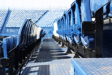Fototapeta premium Folding seating installed on Grandstand in the stadium. 