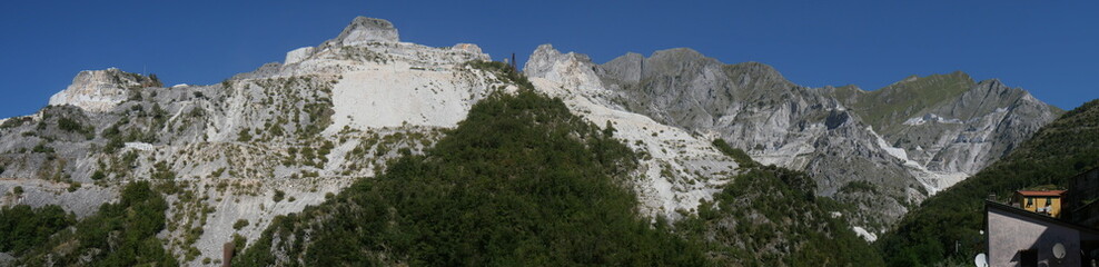 panorama from Colonnata on marble quarries among the green of the Apuan Alps from the village of Codena