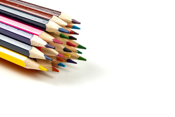 Colored pencils in a stack isolated on a white background. close-up, copy space