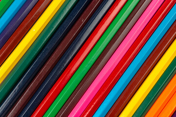 Colored pencils in the form of an abstract background. close-up.