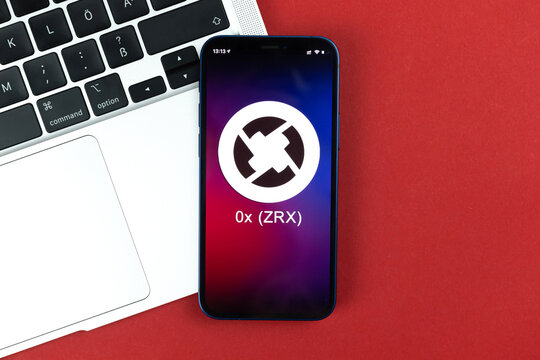 0x ZRX symbol. Trade with cryptocurrency, digital and virtual money, banking with mobile phone concept. Business workspace, table with laptop top view photo