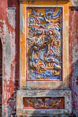 Decoration on gate of the Hien Lam Cac house in the Imperial City with the Purple Forbidden City within the Citadel in Hue, Vietnam. Imperial Royal Palace of Nguyen dynasty