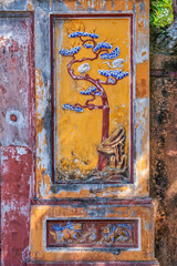 Decoration on gate of the Hien Lam Cac house in the Imperial City with the Purple Forbidden City within the Citadel in Hue, Vietnam. Imperial Royal Palace of Nguyen dynasty