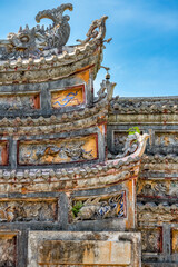 Naklejka premium Decoration on gate of the Hien Lam Cac house in the Imperial City with the Purple Forbidden City within the Citadel in Hue, Vietnam. Imperial Royal Palace of Nguyen dynasty