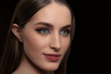 Fototapeta premium Head shot beautiful creative make up of smiling woman with long straight hair. Beauty, makeup and cosmetics concept