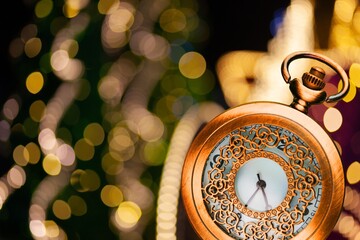2022 New Year concept with Clock And Fireworks, Golden Abstract Defocused Background