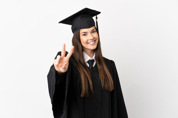 Teenager Brazilian university graduate over isolated white background smiling and showing victory...