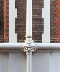 Amsterdam Nes Street Brick Wall with Ornamental Grotesque Rain Pipe Detail, Netherlands