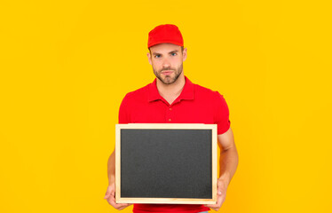 guy make announcement. male behind chalkboard. place for useful information.