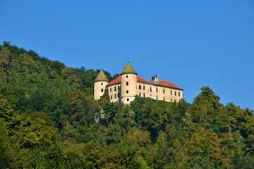 Fototapeta na wymiar View of Podcetrtek castle surrounded by a forest in Stajerska, Slovenia