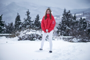 Beautiful girl and snowy forest