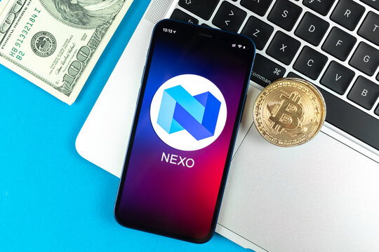 Nexo coin symbol. Trade with cryptocurrency, digital and virtual money, banking with mobile phone concept. Business workspace, table with laptop top view photo