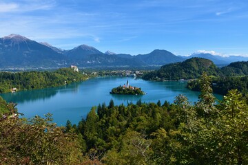 Scenic view of lake Bled in Slovenia with a church on an island and mountains behind